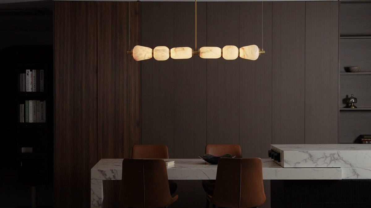 The Architectural Antidote to Glare: Styling the Alabaster Pebble Linear Chandelier in Modern Japandi Dining Spaces