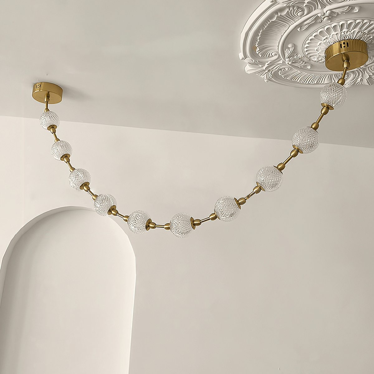 Strand Necklace Curated Optical Acrylic Chandeli – illuminated warm ambiance setting #1