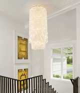 Capelia Column Curated Iron & Glass Chandelier warm illuminated room view