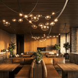 Orvyn Leather Arc Curated Mouth-Blown Frosted Gl – illuminated warm ambiance setting