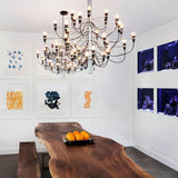 Tiered Branch Curated Solid Brass Chandelier installed in residential dining space
