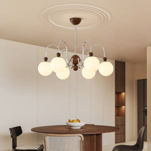 Aurora Loop Curated Mouth-Blown Frosted Glass Ch installed in residential dining space