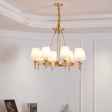 Antique Brass Curated Solid Brass Chandelier installed in residential dining space