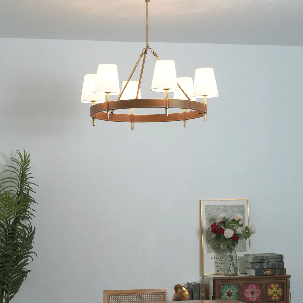 Arianna Leather Curated Solid Brass Chandelier warm illuminated room view