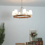 Arianna Leather Curated Solid Brass Chandelier warm illuminated room view