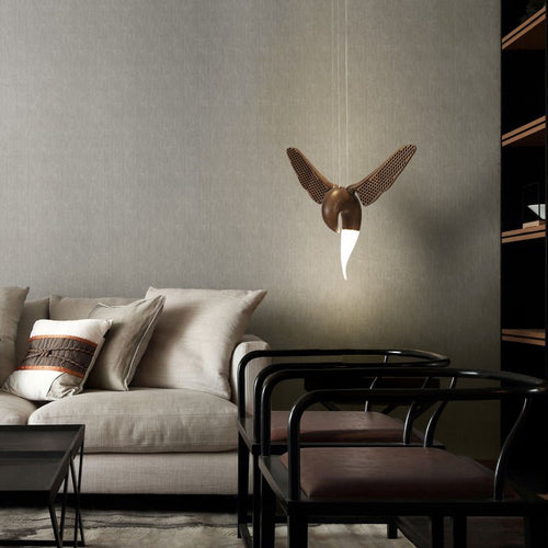 Avian Flight Curated Iron & Glass Chandelier installed in residential dining space