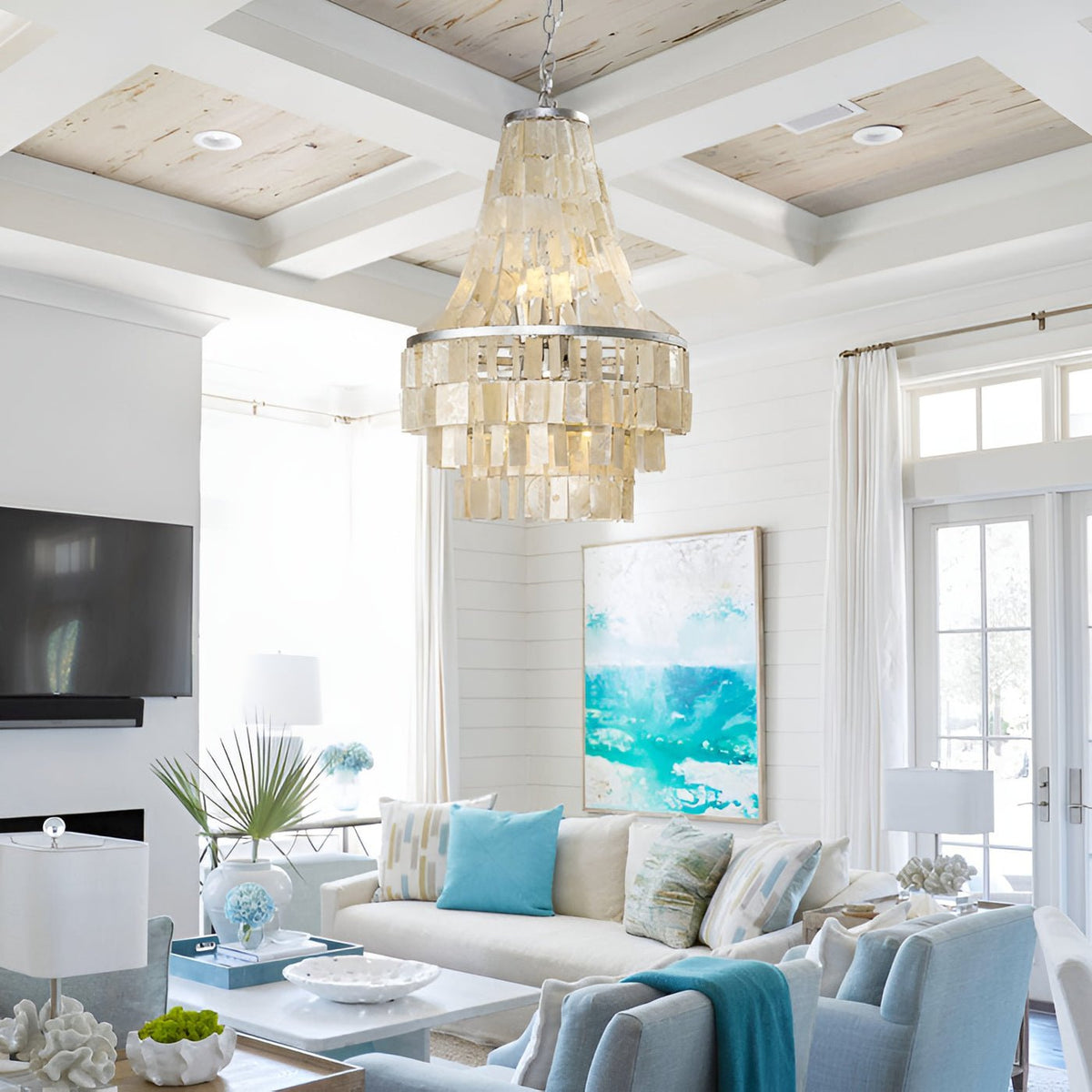 Boho Shell Tiered Curated Iron & Glass Chandelie warm illuminated room view