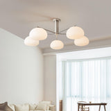 Briette Curated Mouth-Blown Frosted Glass Chande warm illuminated room view