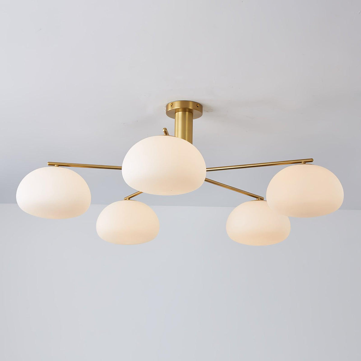 Briette Curated Mouth-Blown Frosted Glass Chande – illuminated warm ambiance setting #1