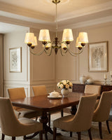 Brimley Curated Mouth-Blown Frosted Glass Chande warm illuminated room view