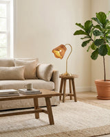 Carmelle Curated Woven Rattan Table Lamp installed in residential dining space