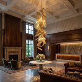 Cattail Leaf Curated Iron & Glass Chandelier warm illuminated room view