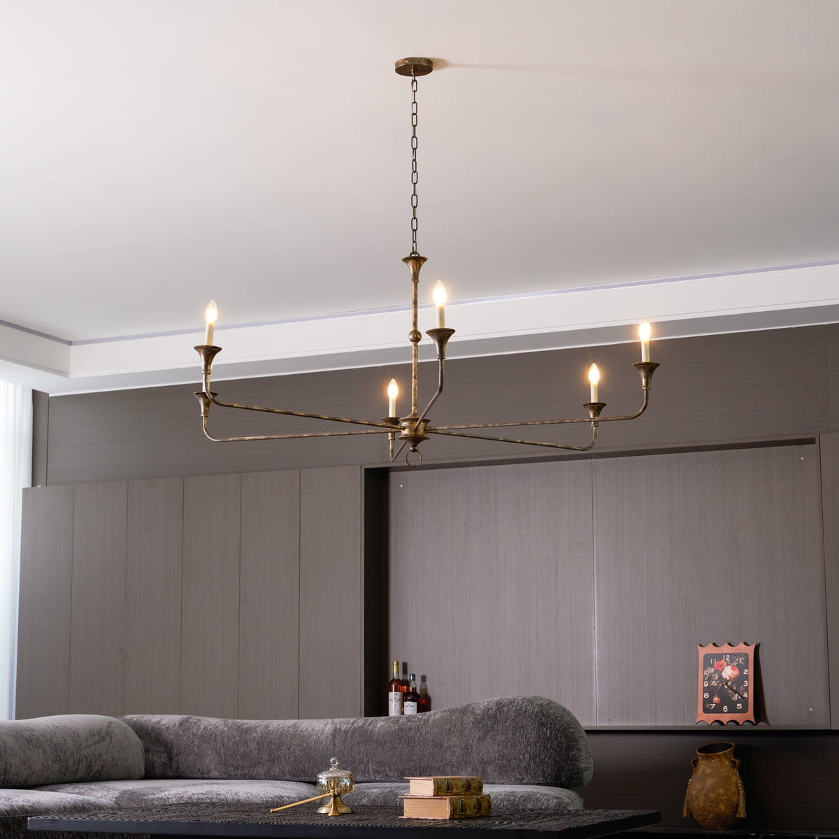 Elara Candle Curated Solid Brass Chandelier installed in residential dining space