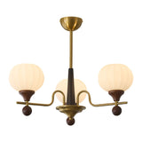 Ceylian Curated Mouth-Blown Frosted Glass Chande – illuminated warm ambiance setting #1