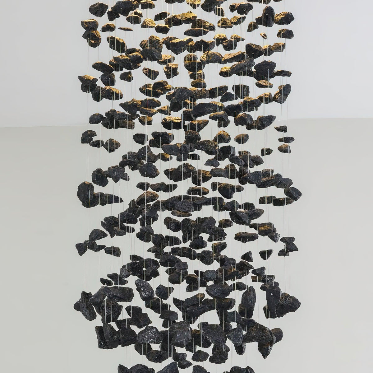 Charcoal Chandeliers L Curated Iron & Glass Chan installed in residential dining space