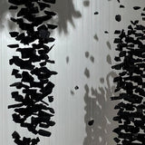 Charcoal Chandeliers L Curated Iron & Glass Chan warm illuminated room view