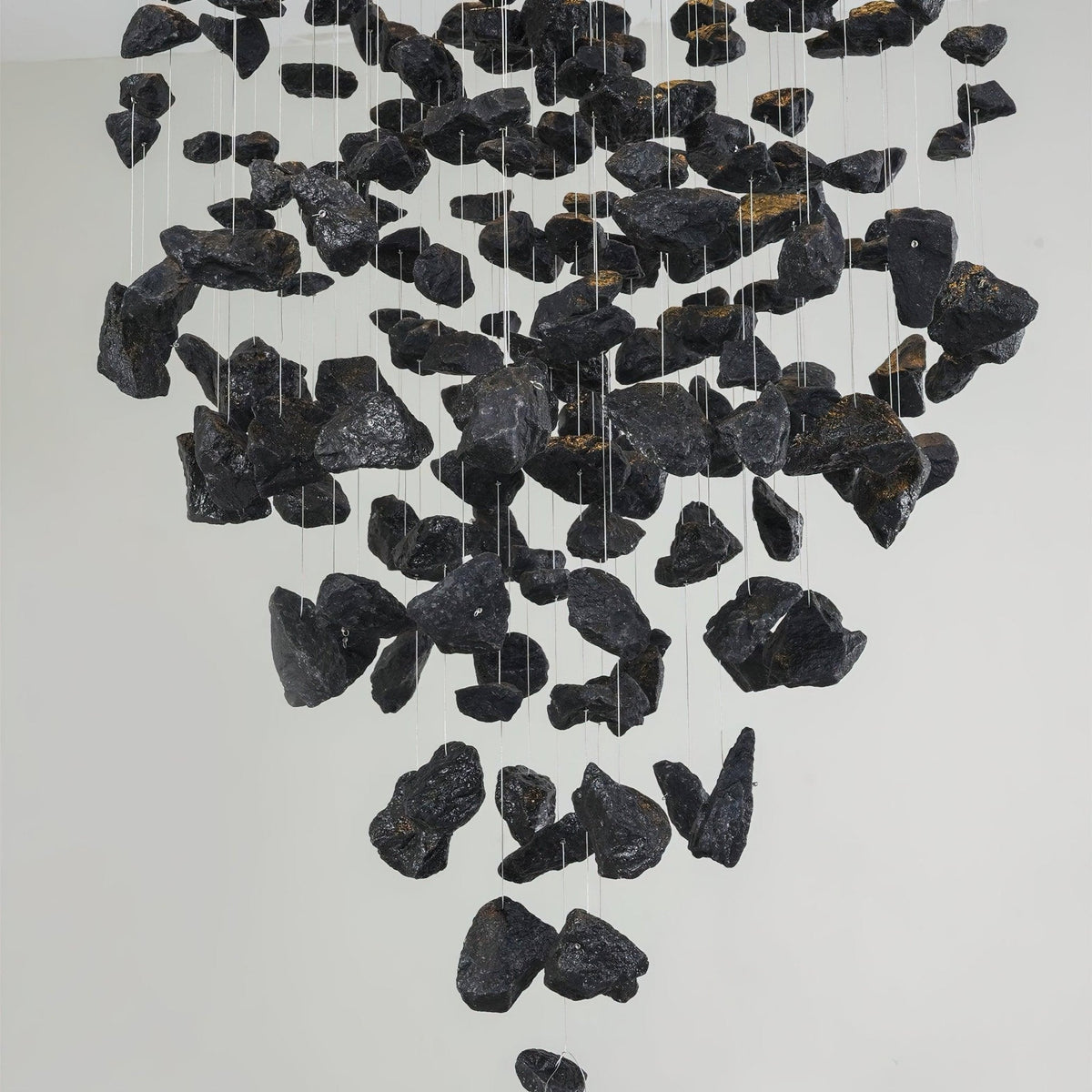 Charcoal Chandeliers W Curated Iron & Glass Chan installed in residential dining space