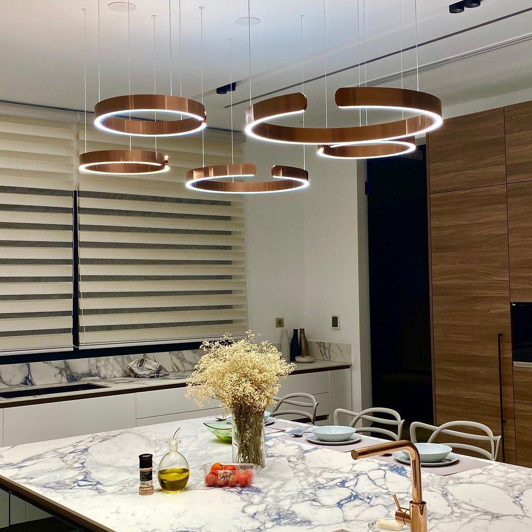 Circular Curated Iron & Glass Chandelier installed in residential dining space