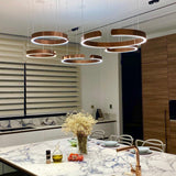 Circular Curated Iron & Glass Chandelier installed in residential dining space