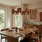 Cirkus Curated Iron & Glass Chandelier warm illuminated room view