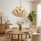 Coconut Disc Curated Iron & Glass Chandelier warm illuminated room view