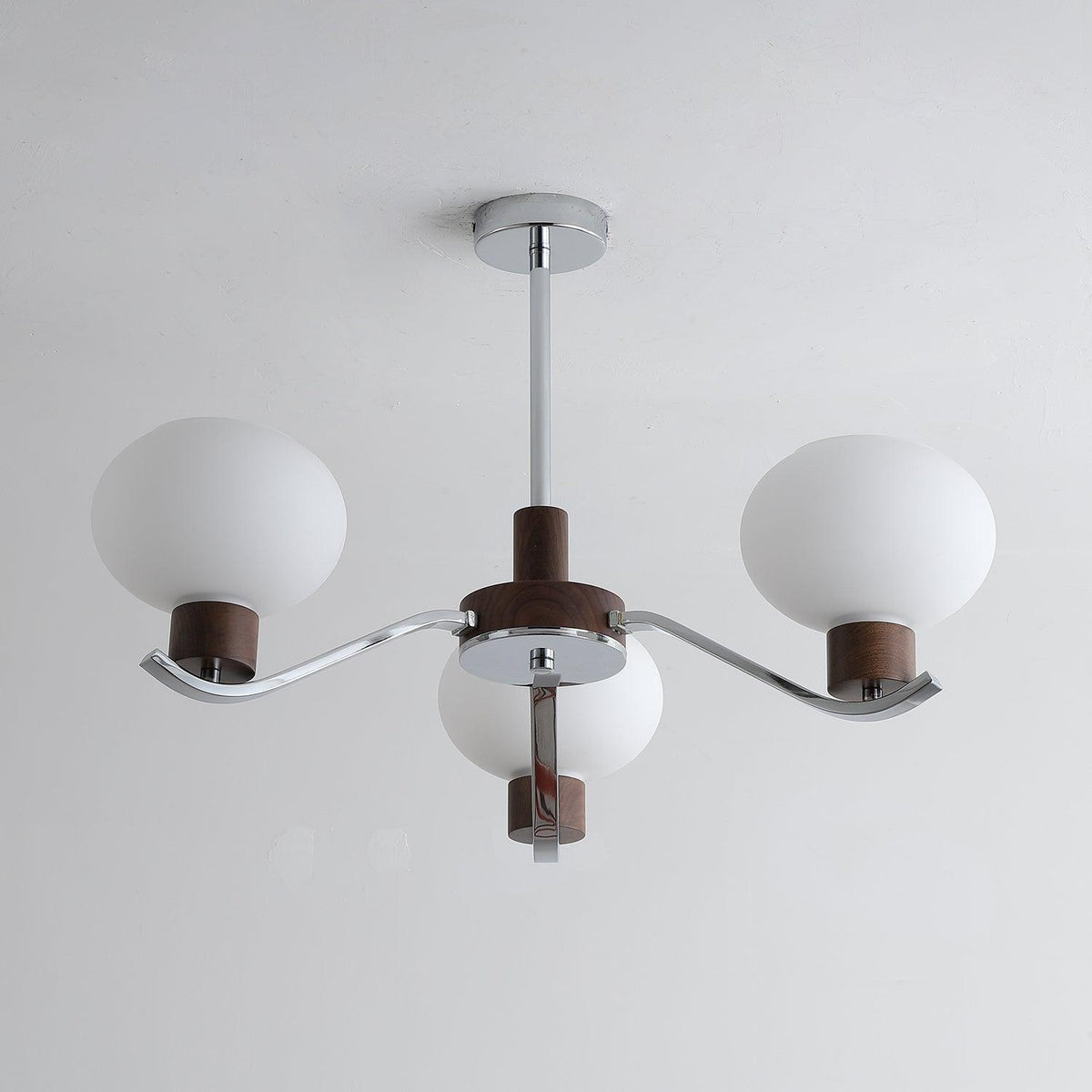Colome Curated Mouth-Blown Frosted Glass Chandel – illuminated warm ambiance setting #1