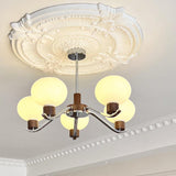 Colome Curated Mouth-Blown Frosted Glass Chandel installed in residential dining space