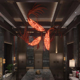 Crimson Swirl Koi Curated Iron & Glass Chandelie – spatial dining room perspective