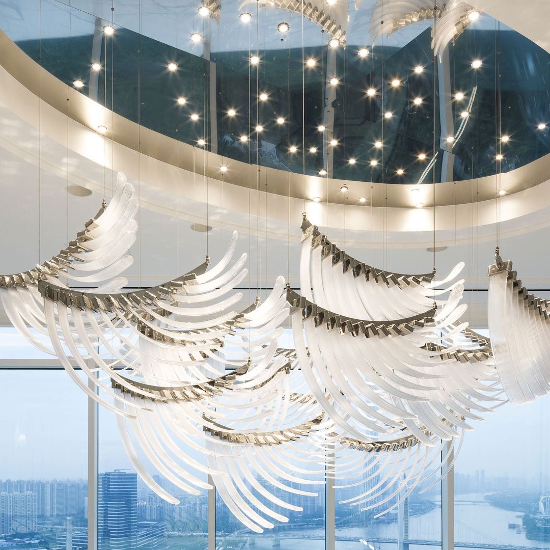 Pluma Sculptural Feather Chandelier warm illuminated room view