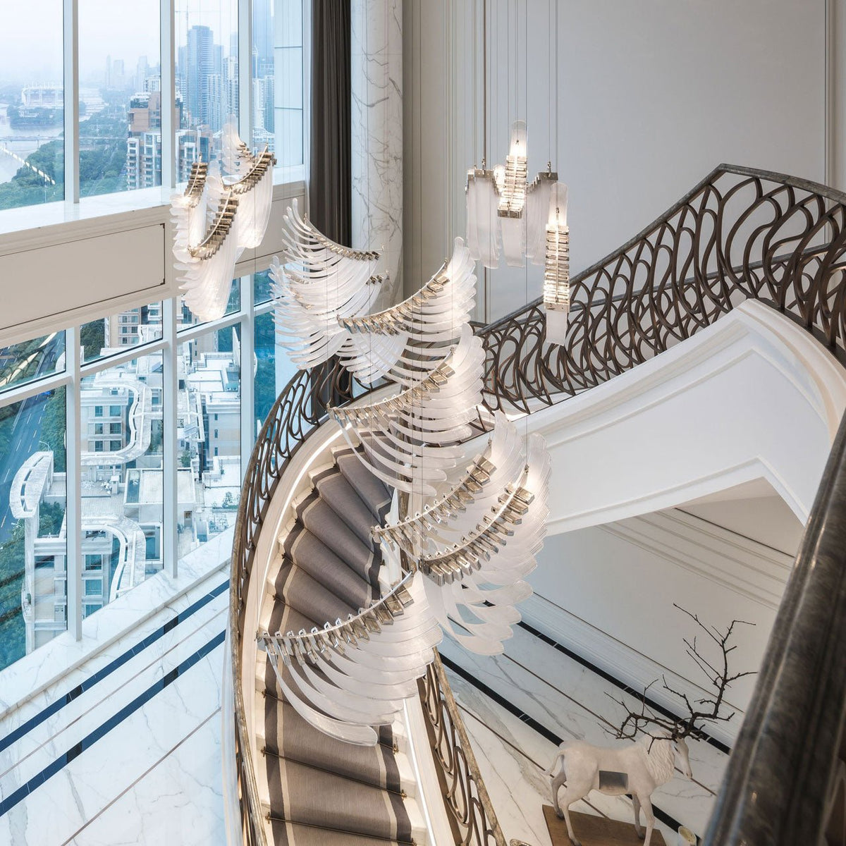 Mouth-Blown Frosted Glass craftsmanship detail on Pluma Sculptural Feather Chandelier