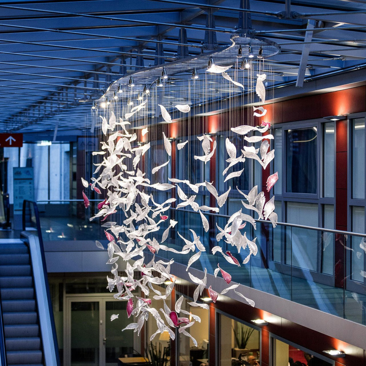 Pluma Sculptural Feather Chandelier – spatial dining room perspective