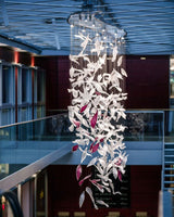 Pluma Sculptural Feather Chandelier – illuminated warm ambiance setting