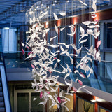 Pluma Sculptural Feather Chandelier installed in residential dining space