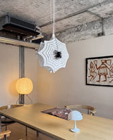 Calvix Curated Finished Iron Pendant Light – illuminated warm ambiance setting