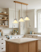 Cavelle Curated Finished Iron Pendant Light warm illuminated room view