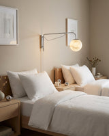 Dione  Alabaster Curated Alabaster Wall Sconce – spatial dining room perspective