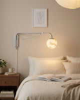 Dione  Alabaster Curated Alabaster Wall Sconce warm illuminated room view