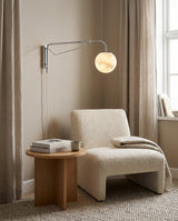 Dione  Alabaster Curated Alabaster Wall Sconce installed in residential dining space