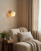 Eala Alabaster Curated Alabaster Wall Sconce – illuminated warm ambiance setting