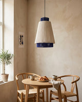 Hoshina Curated Finished Iron Pendant Light warm illuminated room view