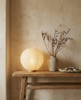 Kumo Curated Woven Rattan Table Lamp installed in residential dining space