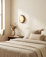Ovela Curated Alabaster Wall Sconce – illuminated warm ambiance setting