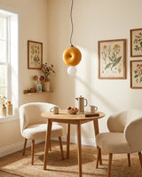Peblume Curated Mouth-Blown Frosted Glass Pendan – illuminated warm ambiance setting