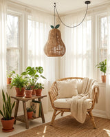 Pomarien Curated Woven Rattan Pendant Light warm illuminated room view
