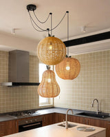 Pomarien Curated Woven Rattan Pendant Light – illuminated warm ambiance setting