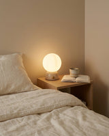 Savio Curated Yellow Travertine Table Lamp warm illuminated room view