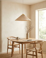 Seretta Curated Iron & Glass Pendant Light – illuminated warm ambiance setting