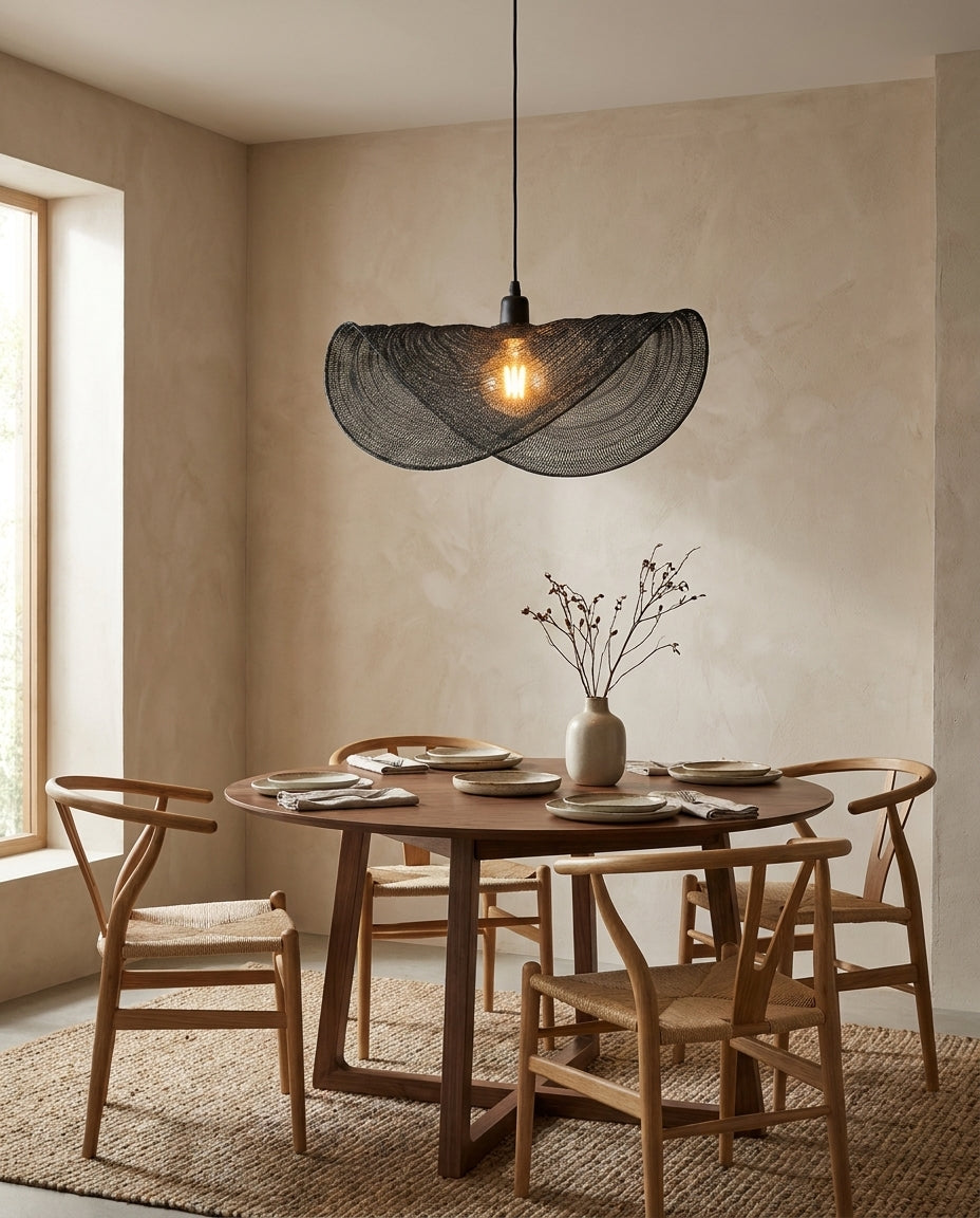 Sinuvera Curated Iron & Glass Pendant Light – illuminated warm ambiance setting