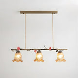 Vinecroft Curated Amber Art Glass Chandelier – illuminated warm ambiance setting #1