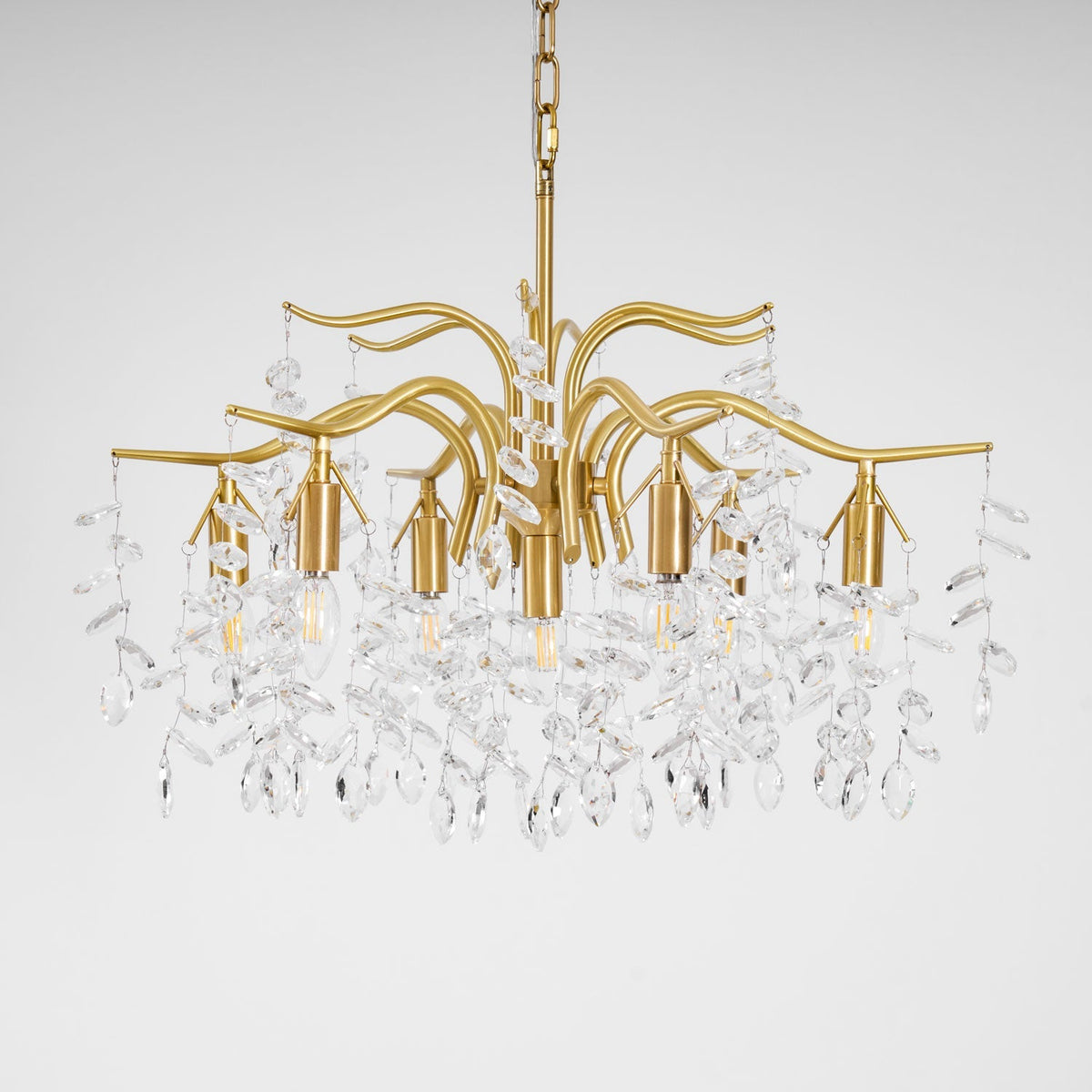 Dorale Curated Solid Brass Chandelier – illuminated warm ambiance setting #1